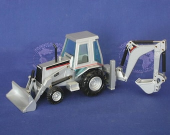 Caterpillar 428 B tractor loader backhoe in silver by NZG 1:50 scale diecast