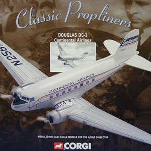 May include: A white and silver model aircraft with red and blue accents. The aircraft is a Douglas DC-3, Continental Airlines. The model is made by Corgi and is a 1:144 scale model.