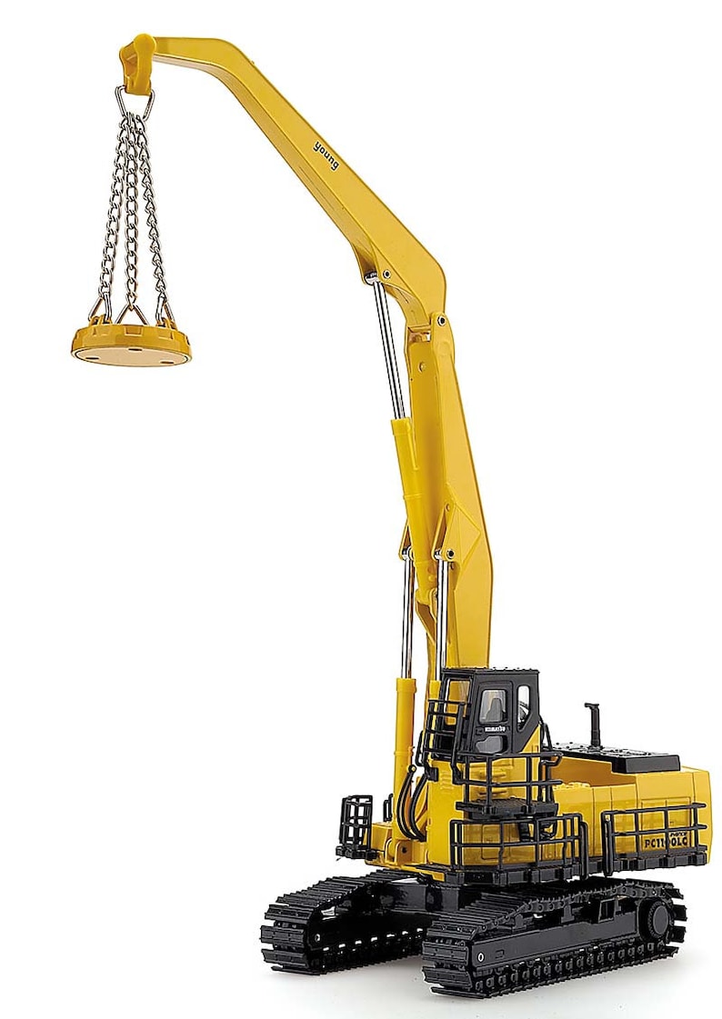 May include: Yellow and black toy construction crane with a magnetic lifting arm and a chain. The crane is on a black track base and has the word "PETTI" on the side.