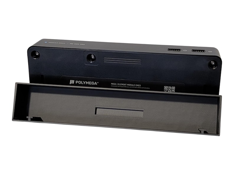 Puede incluir: Un dispositivo electr&oacute;nico negro con el texto "POLYMEGA" y "MEGA 1 ELEMENT MODULE EM03". El dispositivo tiene una bandeja extra&iacute;ble y varios puertos. El dispositivo es rectangular y tiene un acabado mate.