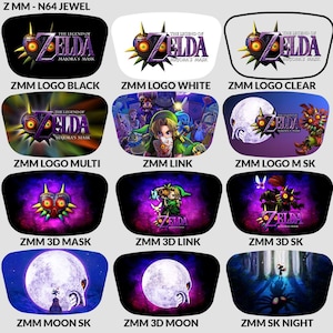Op de afbeelding: Een verzameling auto-zonneschermen met ontwerpen uit "The Legend of Zelda: Majora's Mask". De zonneschermen tonen graphics zoals het logo van de game, personages en iconische beelden in diverse kleuren.