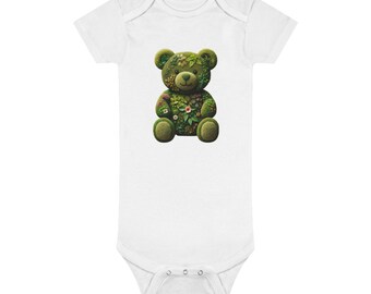 May include: A white baby grow with a green teddy bear design. The bear is made of leaves and flowers.