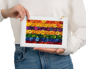 May include: A white zippered pouch with a rainbow floral design. The flowers are arranged in stripes of red, orange, yellow, green, blue, indigo, and violet.