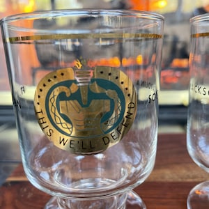 INCREDIBLE This We&#39;ll Defend Cocktail Beer Glasses Ft Jackson Fort South Carolina Man Cave Whiskey & Coke