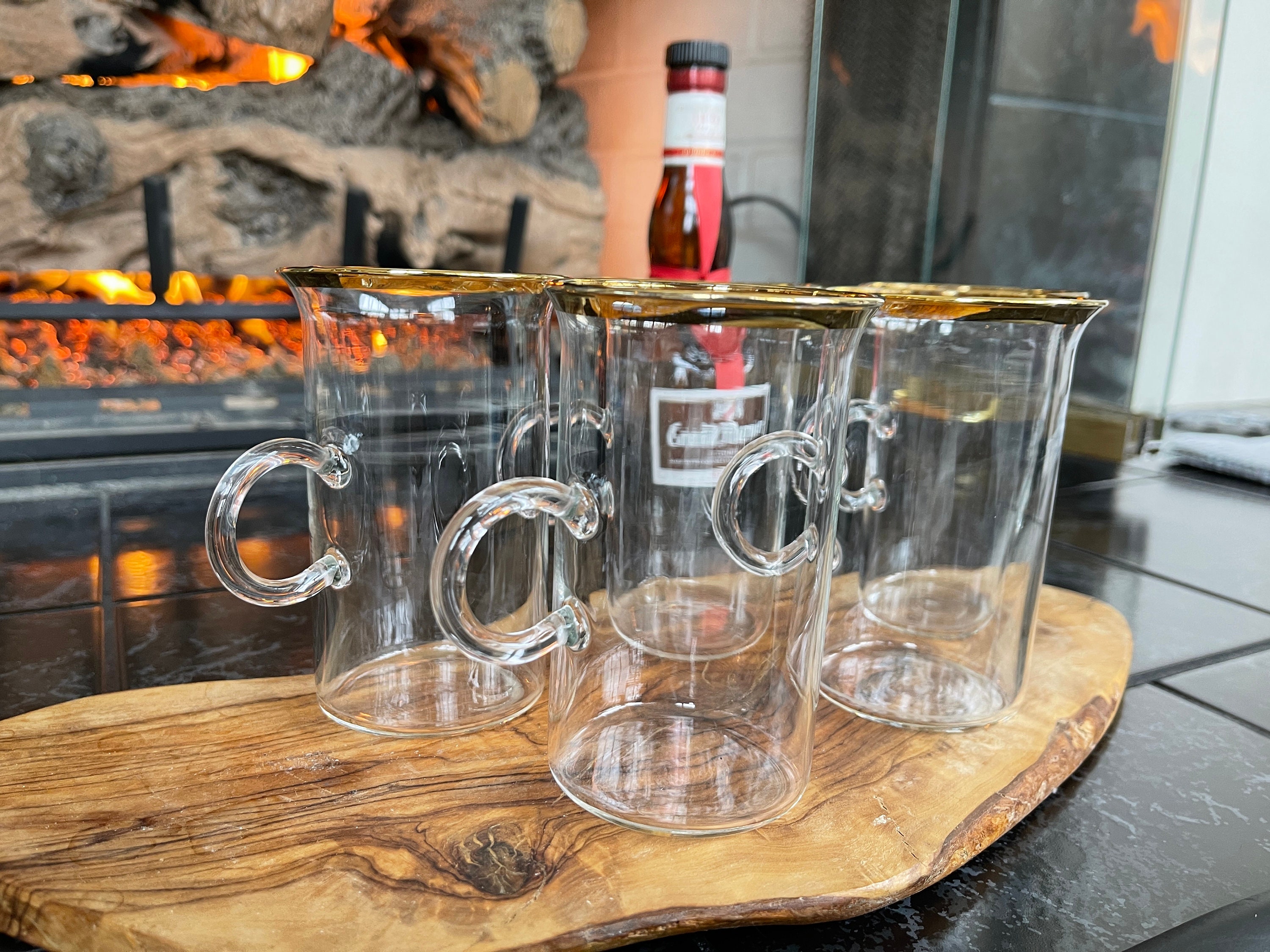 Premium AI Image  A pair of hot toddy glasses gently resting on a wooden  table