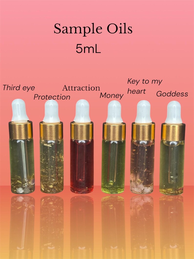 May include: Six small glass sample oil bottles with gold-colored tops and white droppers. The bottles contain various colored liquids and herbs. Text on the image reads "Sample Oils 5mL" and labels each bottle with a different intention: "Third eye", "Protection", "Attraction", "Money", "Key to my heart", and "Goddess".