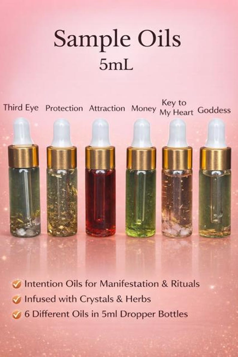 May include: Six 5ml dropper bottles of sample oils, each with a different colour and contents. The bottles are labelled "Third Eye," "Protection," "Attraction," "Money," "Key to My Heart," and "Goddess." The text "Sample Oils" and "5mL" are at the top.