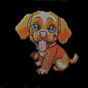 May include: A brown and white puppy with blue eyes, made of rhinestones, is sitting with its tongue sticking out. The puppy is wearing a red and white bow.