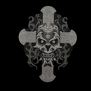 May include: A silver skull with a cross behind it, made of rhinestones. The skull has a menacing expression with large eyes and a wide mouth.