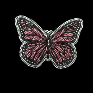 May include: A butterfly-shaped rhinestone applique. The butterfly has black wings with pink and white accents. The wings are outlined in white rhinestones, and the body is black.