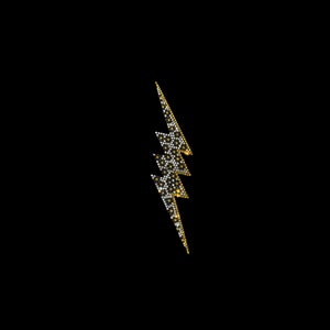 May include: A gold and black lightning bolt design made of small, round, shiny beads.