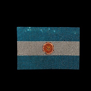 May include: A blue and white flag with a sun in the center. The flag is made of small, shiny squares.