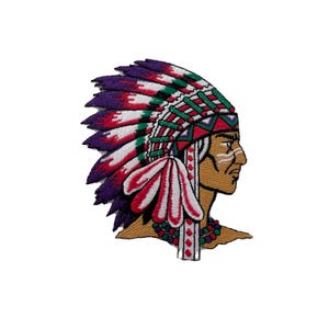 May include: Embroidered patch of a Native American man wearing a colorful headdress with feathers. The headdress is red, white, green, and purple. The man has a brown face with white lines painted on his face.