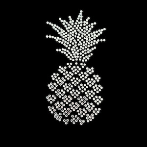 May include: A white pineapple design made of rhinestones on a black background.