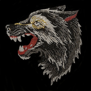 May include: A detailed, sparkling image of a wolf's head in profile, rendered in a mosaic of small, glittering rhinestones. The wolf's open mouth reveals a red interior, with red accents on the ears. The background is solid black.