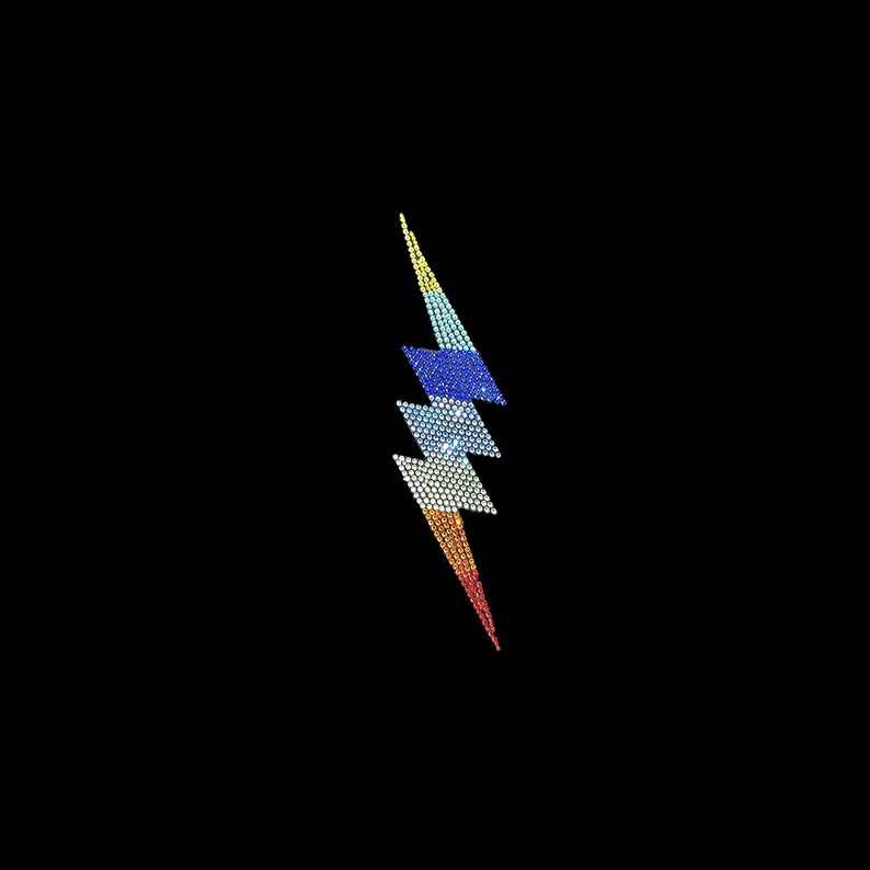 May include: A rainbow-coloured lightning bolt design made of rhinestones. The design is on a black background.