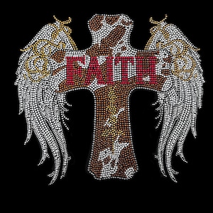 May include: A brown cross with the word "FAITH" in red letters is surrounded by two white wings with gold accents. The cross and wings are made of rhinestones.