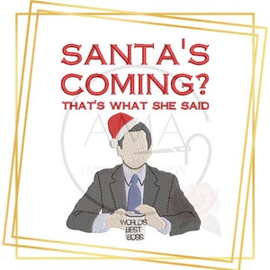 May include: A red and white Santa hat sits on the head of a man wearing a dark suit and tie. He is holding a mug that says "World's Best Boss". The text above him reads "Santa's Coming? That's What She Said".
