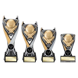 May include: Four trophies of varying heights featuring a gold-coloured eight ball and crossed pool cues on a textured grey background. Each trophy has a black base with a gold-coloured plate that reads "YOUR ENGRAVING HERE" in black text.
