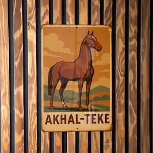 May include: A rectangular metal sign featuring a brown horse with the text "AKHAL-TEKE" at the bottom. The background depicts a landscape with a sunset and rolling hills. The sign is mounted on a wooden slatted wall.