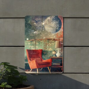 May include: A red armchair with a high back sits in a room with a green and brown wall. A large moon and stars are painted on the wall behind the chair. A lamp with a white shade sits on a small table next to the chair.