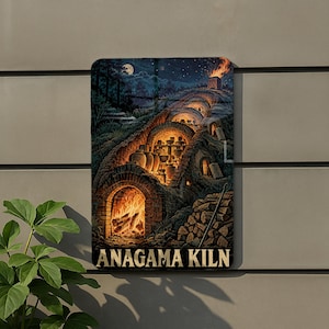 May include: A rectangular metal sign featuring a detailed illustration of an Anagama kiln built into a hillside at night. The artwork depicts glowing orange fire inside the arched chambers, stacked pottery, and the text ANAGAMA KILN at the bottom.