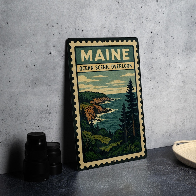 A framed poster of the Maine Ocean Scenic overlook, featuring a scenic landscape with a rocky coastline, pine trees, and the ocean.