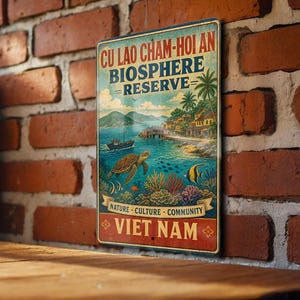 May include: Vintage metal sign featuring a colorful illustration of the Cu Lao Cham-Hoi An Biosphere Reserve in Vietnam. The artwork depicts a coastal scene with a turtle, fish, coral, and a boat. The sign includes the text "NATURE - CULTURE - COMMUNITY".