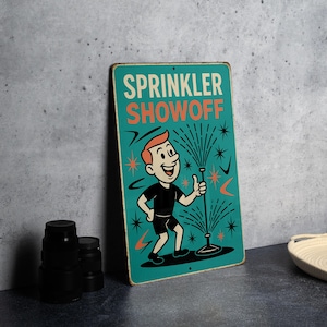 May include: A vintage-style metal sign with the words "SPRINKLER SHOWOFF" in cream and orange. The sign features a cartoon illustration of a person holding a sprinkler, with water spraying out. The background is teal.