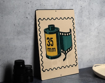 Vintage 35mm Film Canister Metal Sign – Retro Photography Stamp Art Wall Decor for Darkroom or Studio