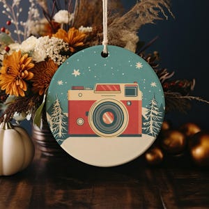 a christmas ornament with a camera on it