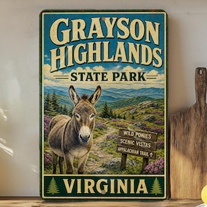 May include: A rectangular metal sign featuring a donkey in front of a mountain landscape. The sign reads "Grayson Highlands State Park" and "Virginia" in a vintage style. A signpost indicates the Appalachian Trail.
