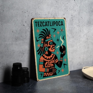 May include: A teal metal sign with the word "TEZCATLIPOCA" at the top. The sign features a stylized illustration of a figure with a headdress, holding a smoking sphere. Orange and black accents with star and arrow details.