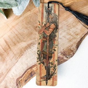 a wooden cross with a tassel hanging from it