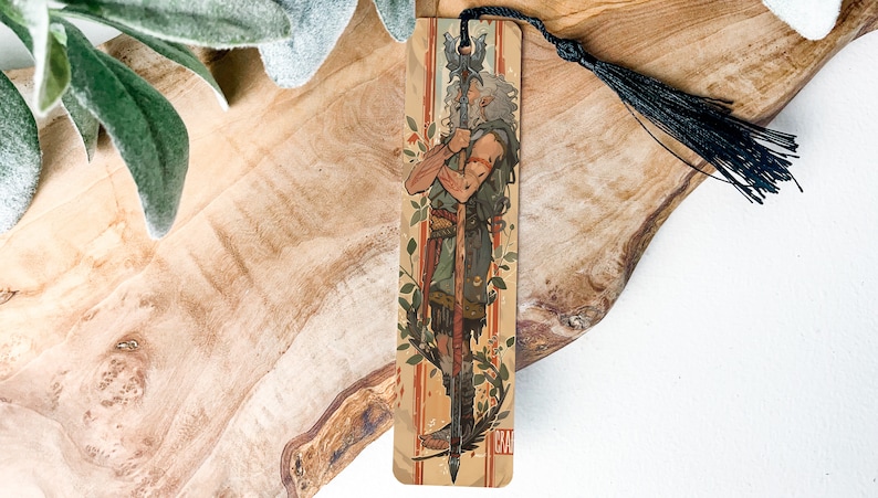 a wooden cross with a tassel hanging from it