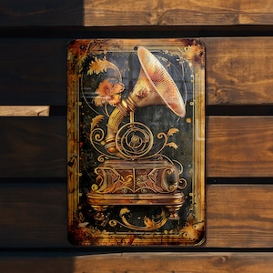 May include: A vintage-style metal sign featuring a gold-colored gramophone with a floral design. The background is dark green with gold accents.