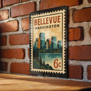 May include: A rectangular metal sign featuring a vintage design of Bellevue, Washington. The sign has a cityscape illustration with the text "Bellevue Washington" and "6c" in a postage stamp style. The sign is displayed against a brick wall.