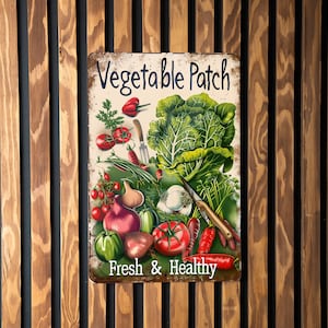 May include: A vintage-style metal sign with a white background and brown text that reads "Vegetable Patch Fresh & Healthy". The sign features a colorful illustration of various vegetables, including tomatoes, onions, garlic, carrots, and green leafy vegetables.