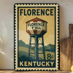 A vintage-style metal sign for Florence, Kentucky, featuring a water tower and the text "FLORENCE Y'ALL KENTUCKY".
