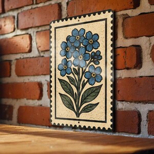 A decorative tile with a floral design is mounted on a brick wall.