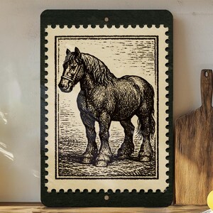 May include: A rectangular metal sign featuring a vintage illustration of a horse, resembling a postage stamp. The horse is depicted in black and white, with a dark green border. The sign is displayed on a wooden surface.