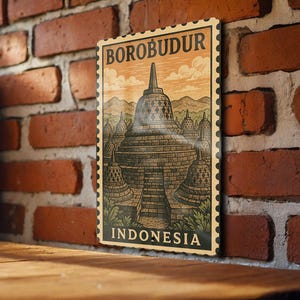 May include: A rectangular sign with a vintage design featuring the Borobudur temple in Indonesia. The sign has a beige background with the words "BOROBUDUR" and "INDONESIA" in a dark brown font. The image is framed with a postage stamp border.