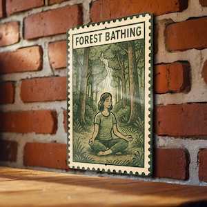 May include: A metal sign with the words "FOREST BATHING" at the top. The sign features an illustration of a person meditating in a forest. The artwork is in shades of green and brown, with a vintage stamp-like border.