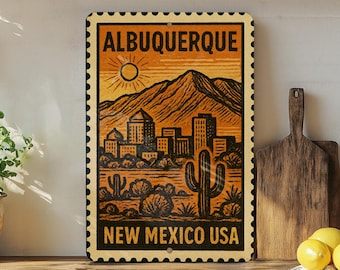 May include: A vintage-style metal sign featuring a desert landscape with mountains, cacti, and a cityscape. The sign reads "ALBUQUERQUE NEW MEXICO USA" in bold lettering, with a stamp-like border and a warm color palette of orange, black, and yellow.