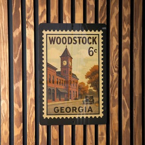 A vintage-style postage stamp from Woodstock, Georgia, featuring a building with a clock tower and the text "WOODSTOCK 6c GEORGIA".