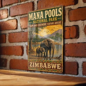 May include: Vintage-style metal sign featuring a scenic illustration of elephants at Mana Pools National Park in Zimbabwe. The sign includes the park's name, location, and a sunset landscape with wildlife. The sign is displayed against a brick wall.