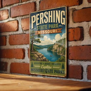 May include: Vintage metal sign for Pershing State Park, Missouri. The sign features a scenic landscape with a lake, trees, and a boat. The text reads "Pershing State Park" and "Explore Missouri State Parks."