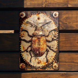 May include: A rusty metal plaque with a detailed, three-dimensional, gold-colored beetle sculpture. The beetle is surrounded by a gear-like design and has a textured, metallic finish.