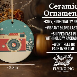 a ceramic ornament with a camera on it