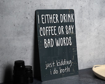 May include: Black metal sign with white text that reads "I either drink coffee or say bad words. Just kidding, I do both."
